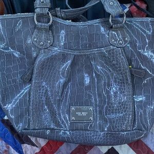 I believe it’s a snake skin or alligator skin never been used in great condition